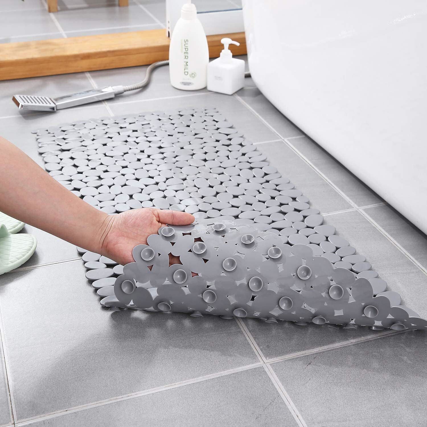 https://assets.dragonmart.ae//pictures/0762438_pebbles-design-bathroom-anti-slip-mat-with-suction-cups-and-drain-holes-grey.jpeg